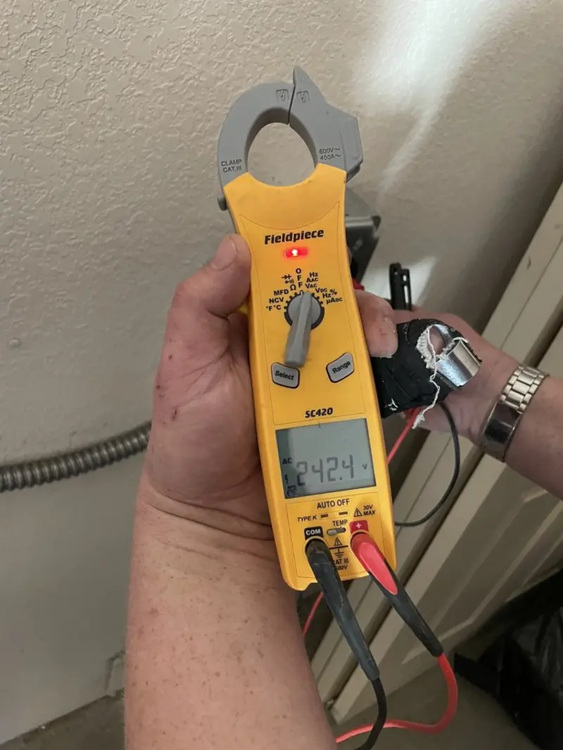 Voltage testing with clamp meter during Electrical Installation Services in Glassboro